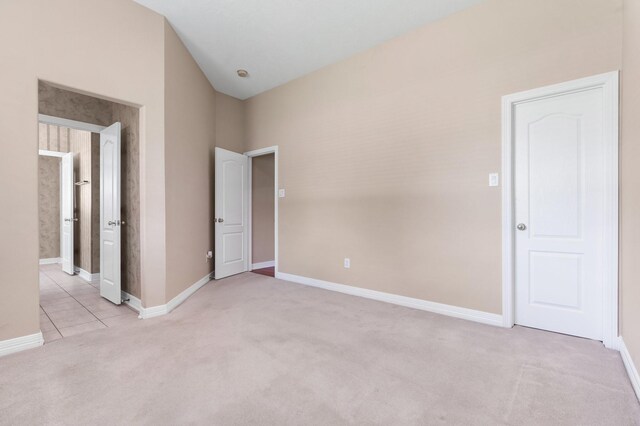 12027 Water Oak Dr, Magnolia, TX 77354 - unfurnished bedroom featuring light colored carpet and baseboards