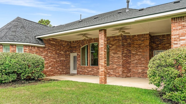 12027 Water Oak Dr, Magnolia, TX 77354 - back of house with a ceiling fan, brick siding, a patio area, a yard, and a shingled roof