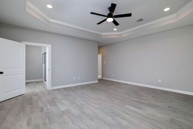 307 Grand Vw, Huntsville, TX 77340 - empty room with a raised ceiling, crown molding, a ceiling fan, wood finished floors, and baseboards