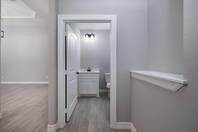 307 Grand Vw, Huntsville, TX 77340 - bathroom with toilet, wood finished floors, and baseboards