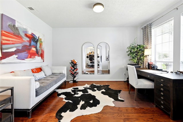 8210 Edenwood Dr, Spring, TX 77389 - home office featuring wood finished floors, a textured ceiling, and baseboards