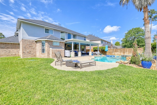 8210 Edenwood Dr, Spring, TX 77389 - back of house with brick siding, ceiling fan, a patio, an outdoor living space, and a shingled roof