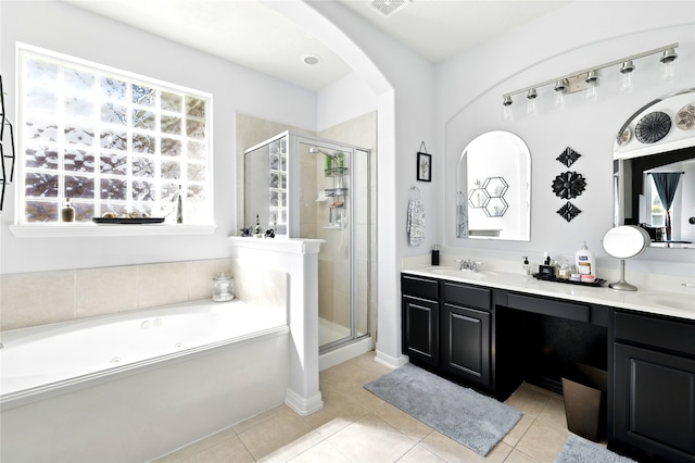 8210 Edenwood Dr, Spring, TX 77389 - bathroom featuring a tub with jets, a stall shower, double vanity, and tile patterned flooring
