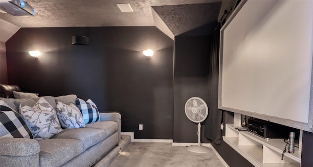 8210 Edenwood Dr, Spring, TX 77389 - carpeted home theater room featuring lofted ceiling and baseboards