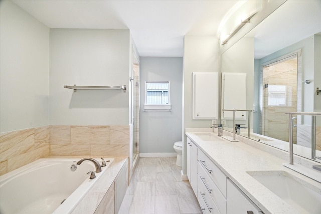 616 Lester St, Houston, TX 77007 - bathroom featuring toilet, double vanity, a shower stall, a garden tub, and baseboards