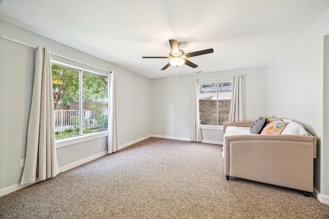 616 Lester St, Houston, TX 77007 - living area featuring ceiling fan, carpet floors, and baseboards