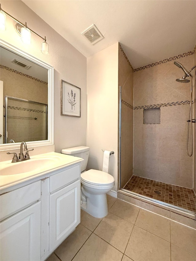 522 Chickory Field Ln, Pearland, TX 77584 - bathroom with toilet, tiled shower, vanity, and tile patterned flooring