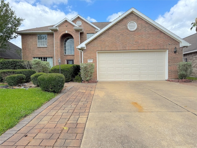 522 Chickory Field Ln, Pearland, TX 77584 - traditional-style house featuring brick siding, driveway, and a garage