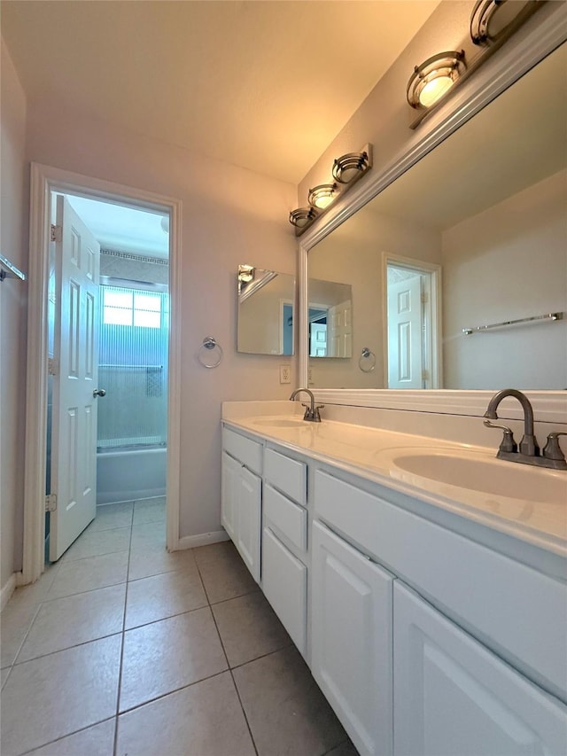 522 Chickory Field Ln, Pearland, TX 77584 - bathroom featuring double vanity, baseboards, tile patterned flooring, and shower / bathtub combination