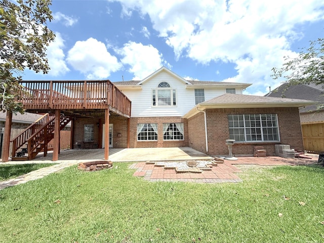 522 Chickory Field Ln, Pearland, TX 77584 - rear view of property featuring brick siding, a patio area, a fire pit, a wooden deck, and stairs