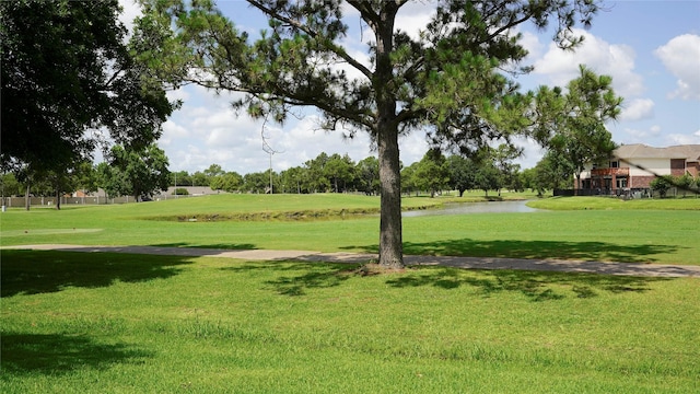 522 Chickory Field Ln, Pearland, TX 77584 - view of home's community featuring a water view and a lawn