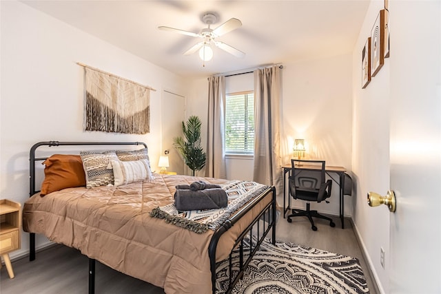 15135 Kamary Ln, San Antonio, TX 78247 - bedroom featuring wood finished floors, baseboards, and a ceiling fan