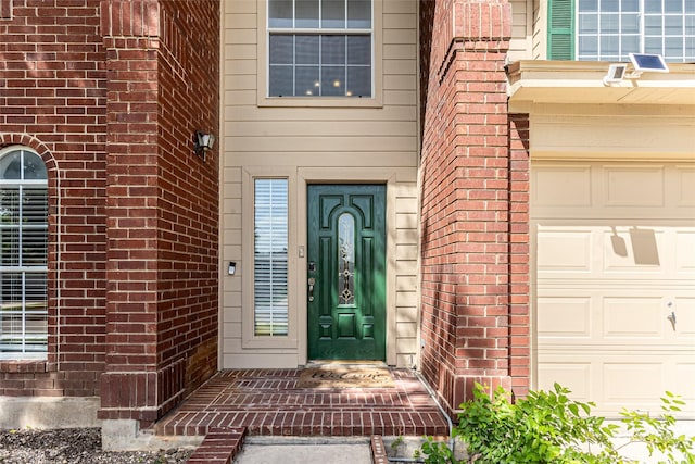 15135 Kamary Ln, San Antonio, TX 78247 - entrance to property featuring a garage and brick siding