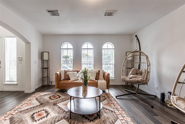 15135 Kamary Ln, San Antonio, TX 78247 - sitting room with dark wood finished floors, arched walkways, and baseboards