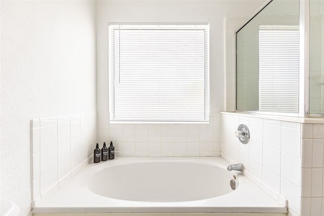 15135 Kamary Ln, San Antonio, TX 78247 - bathroom with a bath and plenty of natural light