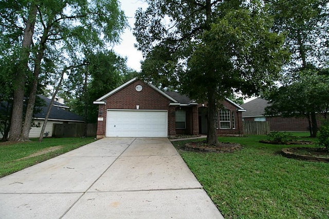 105 N Hollylaurel Cir, The Woodlands, TX 77382 - single story home with an attached garage, brick siding, and driveway