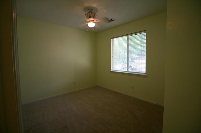 105 N Hollylaurel Cir, The Woodlands, TX 77382 - spare room featuring ceiling fan, carpet, and baseboards