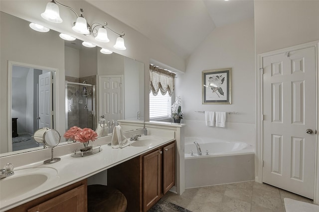 8810 Sailing Dr, Humble, TX 77346 - ensuite bathroom featuring vaulted ceiling, a shower stall, a garden tub, and double vanity