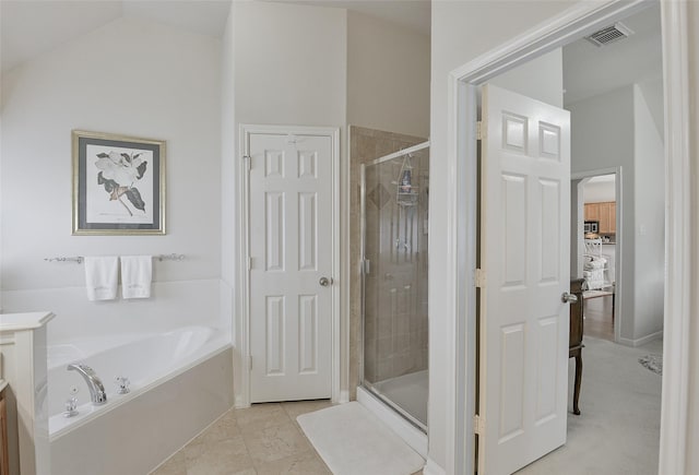 8810 Sailing Dr, Humble, TX 77346 - full bath with a bath, a shower stall, lofted ceiling, and vanity