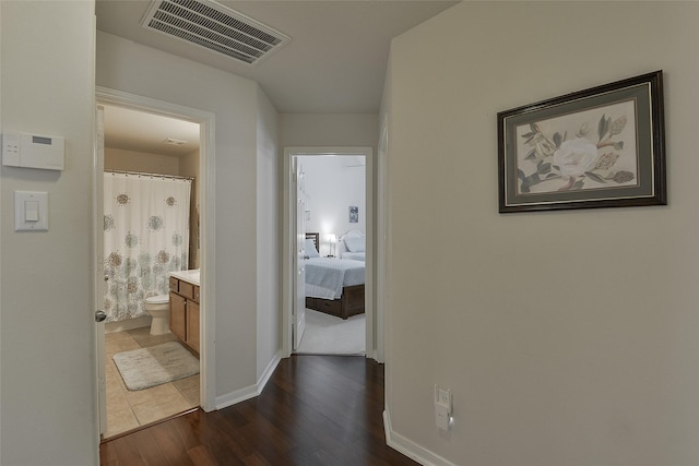 8810 Sailing Dr, Humble, TX 77346 - hall with dark wood finished floors and baseboards
