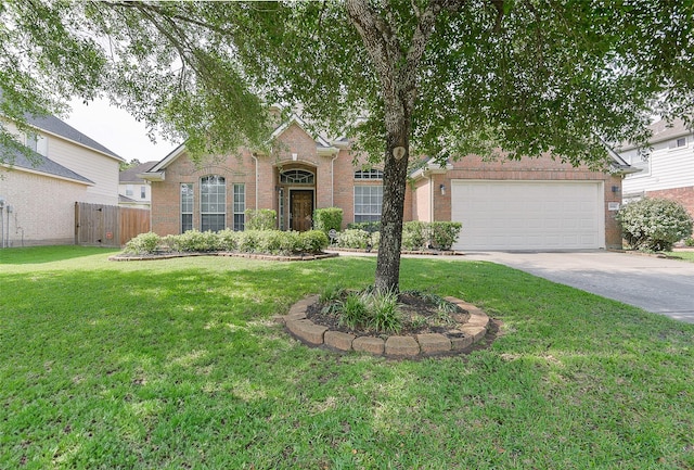 8810 Sailing Dr, Humble, TX 77346 - view of front of property featuring brick siding, driveway, and a garage