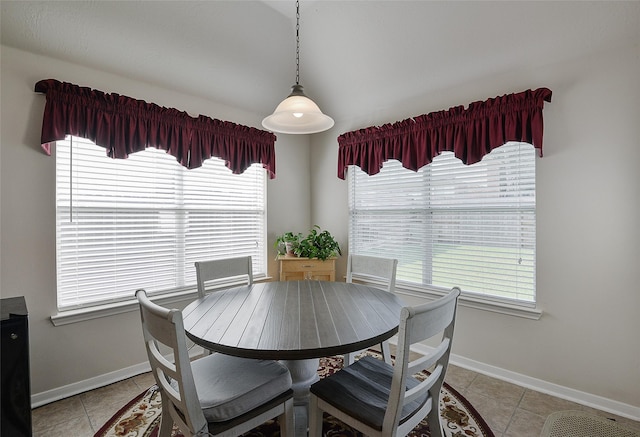 8810 Sailing Dr, Humble, TX 77346 - dining space featuring baseboards, light tile patterned floors, and plenty of natural light