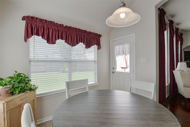 8810 Sailing Dr, Humble, TX 77346 - dining room with vaulted ceiling, wood finished floors, and baseboards