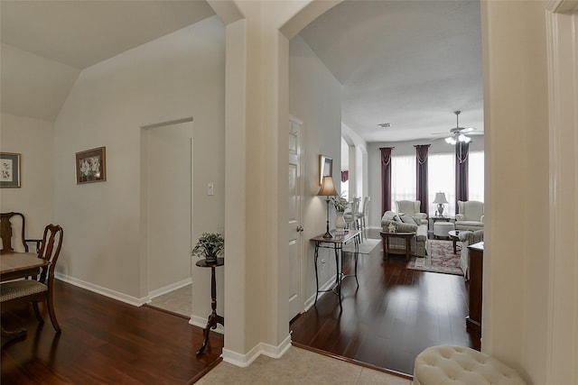 8810 Sailing Dr, Humble, TX 77346 - corridor with arched walkways, dark wood-style flooring, and baseboards
