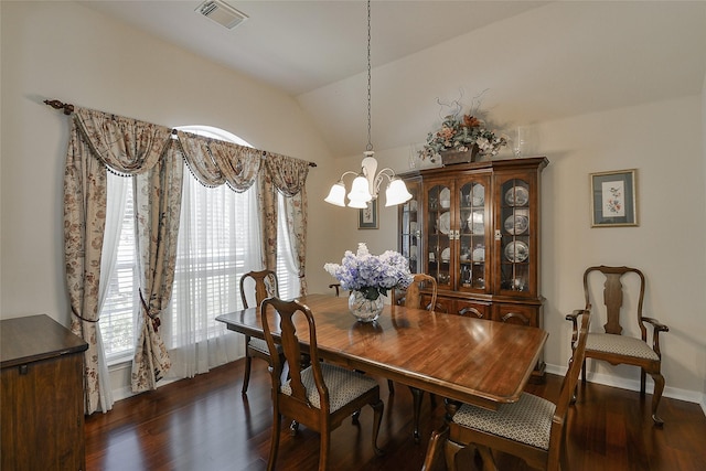 8810 Sailing Dr, Humble, TX 77346 - dining area with a chandelier, dark wood-type flooring, and lofted ceiling