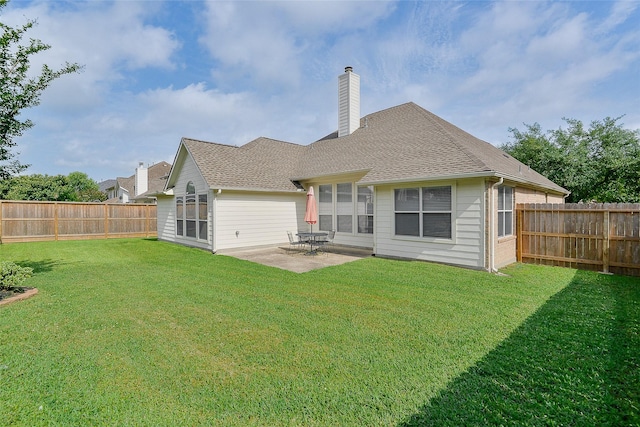8810 Sailing Dr, Humble, TX 77346 - rear view of property with a chimney, a patio, and a shingled roof