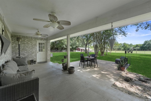 31047 Torrey Rd, Waller, TX 77484 - view of patio with outdoor dining space, ceiling fan, and an outdoor hangout area