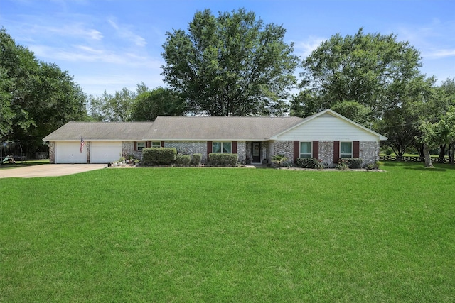 31047 Torrey Rd, Waller, TX 77484 - ranch-style home with a front yard, driveway, a garage, and brick siding