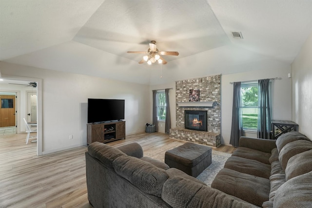 31047 Torrey Rd, Waller, TX 77484 - living room with ceiling fan, lofted ceiling, plenty of natural light, light wood-type flooring, and a brick fireplace