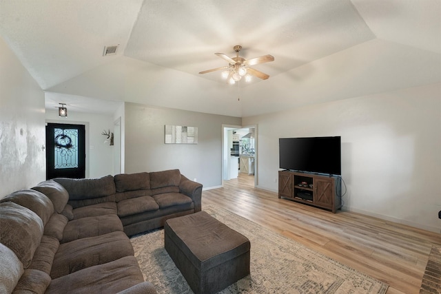 31047 Torrey Rd, Waller, TX 77484 - living area featuring light wood finished floors, a ceiling fan, lofted ceiling, healthy amount of natural light, and baseboards