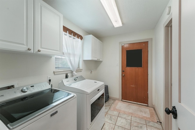 31047 Torrey Rd, Waller, TX 77484 - washroom with cabinet space, washer and dryer, and baseboards