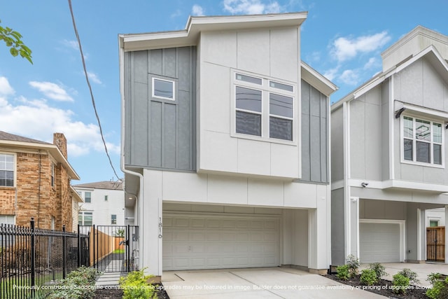 1818 Colquitt St, Houston, TX 77098 - view of front of property with an attached garage, concrete driveway, and board and batten siding