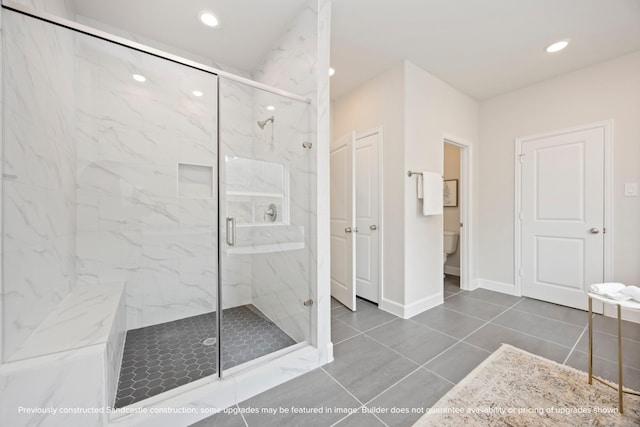 1818 Colquitt St, Houston, TX 77098 - full bath featuring a marble finish shower, toilet, recessed lighting, baseboards, and tile patterned flooring