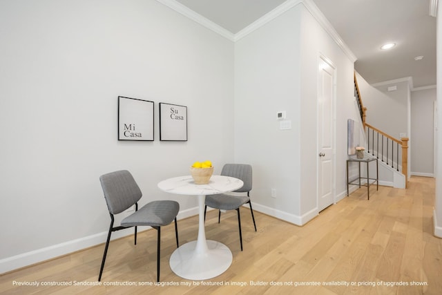 1818 Colquitt St, Houston, TX 77098 - dining room with light wood-type flooring, ornamental molding, baseboards, stairs, and recessed lighting