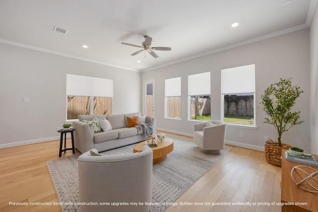 1818 Colquitt St, Houston, TX 77098 - living room featuring light wood-style flooring, baseboards, ceiling fan, recessed lighting, and crown molding