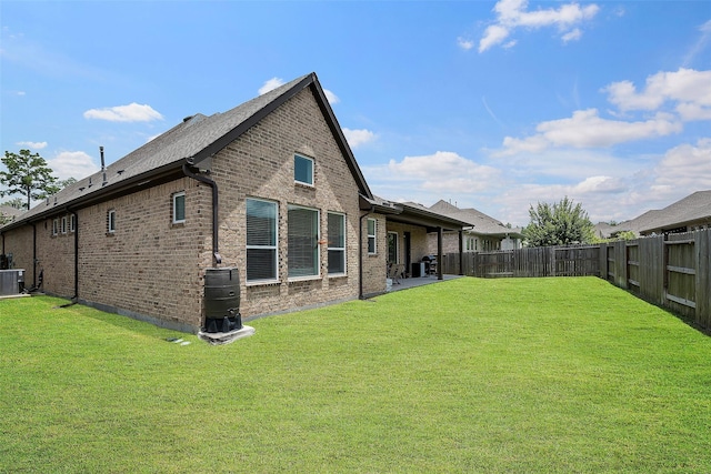 15240 Hemingway Heights Dr, Conroe, TX 77302 - back of house with cooling unit and brick siding