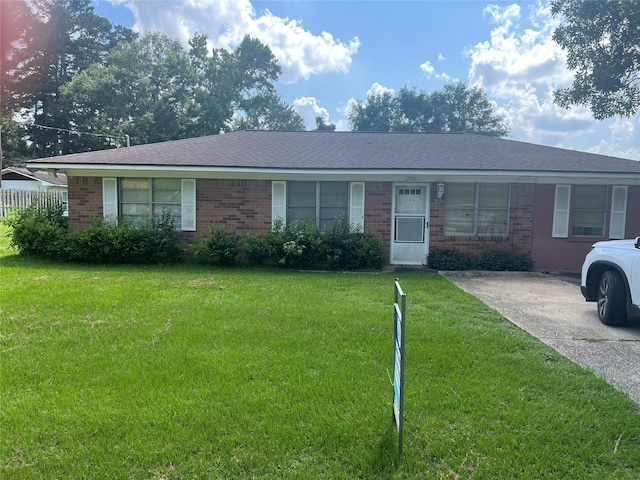 2991 Mimosa Ln, Huntsville, TX 77320 - ranch-style house featuring brick siding and a front yard