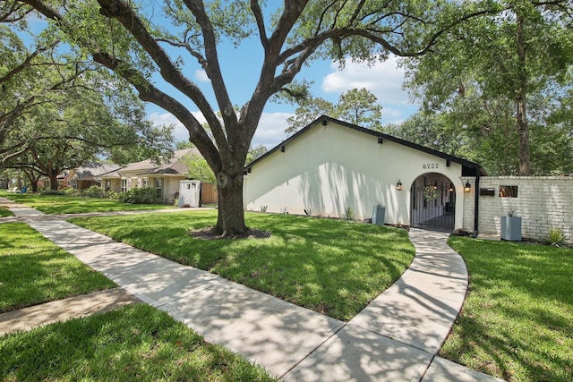6222 Queensloch Dr, Houston, TX 77096 - view of front of property featuring a front yard and cooling unit