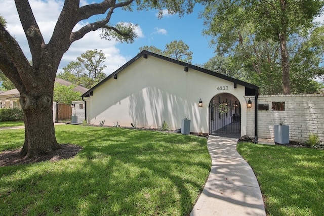 6222 Queensloch Dr, Houston, TX 77096 - view of front of house with a gate and central air condition unit