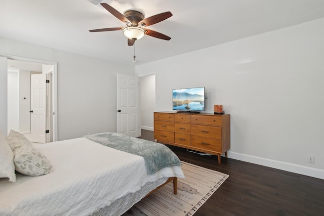 6222 Queensloch Dr, Houston, TX 77096 - bedroom with baseboards, dark wood finished floors, and a ceiling fan