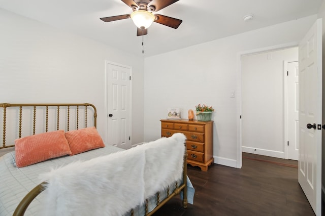 6222 Queensloch Dr, Houston, TX 77096 - bedroom with dark wood-style flooring, baseboards, and ceiling fan