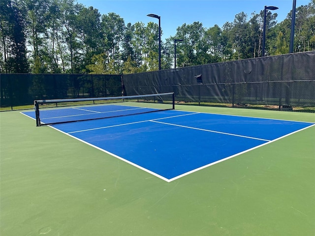 7419 Caprock Canyon Ln, Porter, TX 77365 - view of tennis court featuring community basketball court