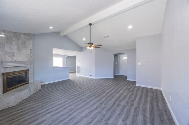 11919 Bald Mountain Cir, Houston, TX 77067 - unfurnished living room featuring a ceiling fan, baseboards, arched walkways, a tile fireplace, and recessed lighting