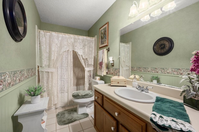 213 Cobb St, Corrigan, TX 75939 - bathroom with a wainscoted wall, toilet, vanity, tile patterned flooring, and a shower with curtain