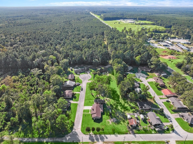 213 Cobb St, Corrigan, TX 75939 - aerial view of property and surrounding area with a heavily wooded area and nearby suburban area