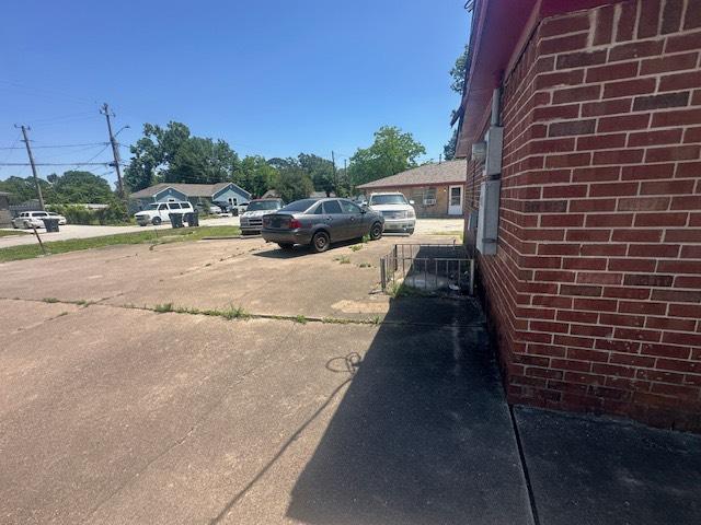 8008 De Priest St, Houston, TX 77088 - view of car parking featuring driveway